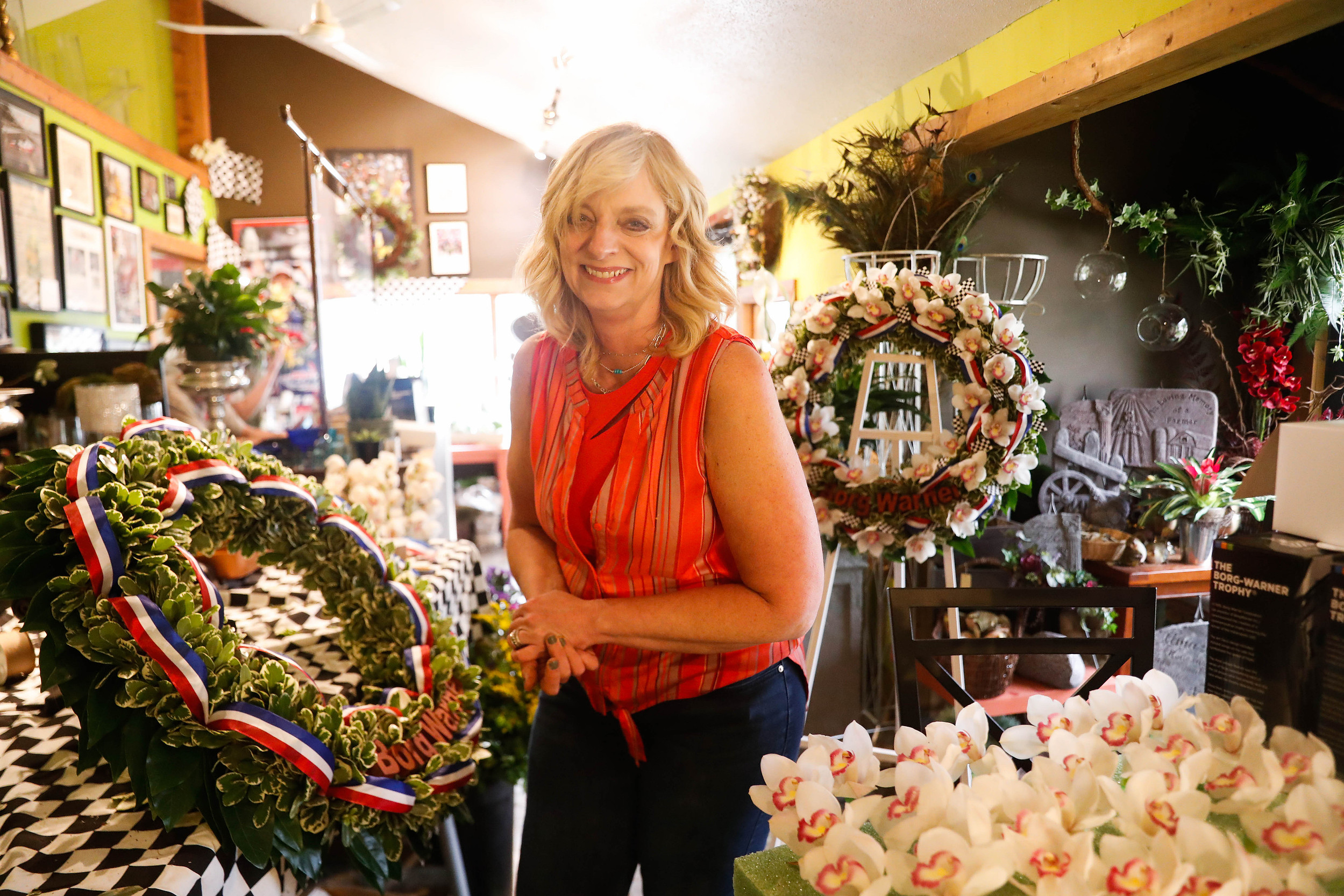 Julie Harman Vance laughs while creating the second Indy 500 Winner's Wreath, which will be used for photos the day after the race, Thursday, May 27, 2021, in Yorktown.